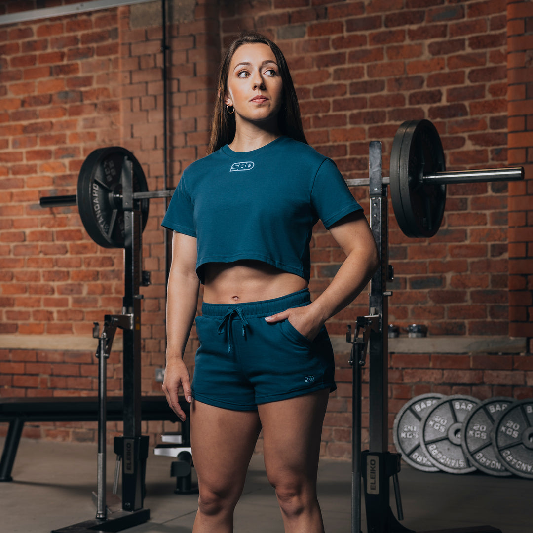 REFLECT TEAL WOMEN'S CROP TOP